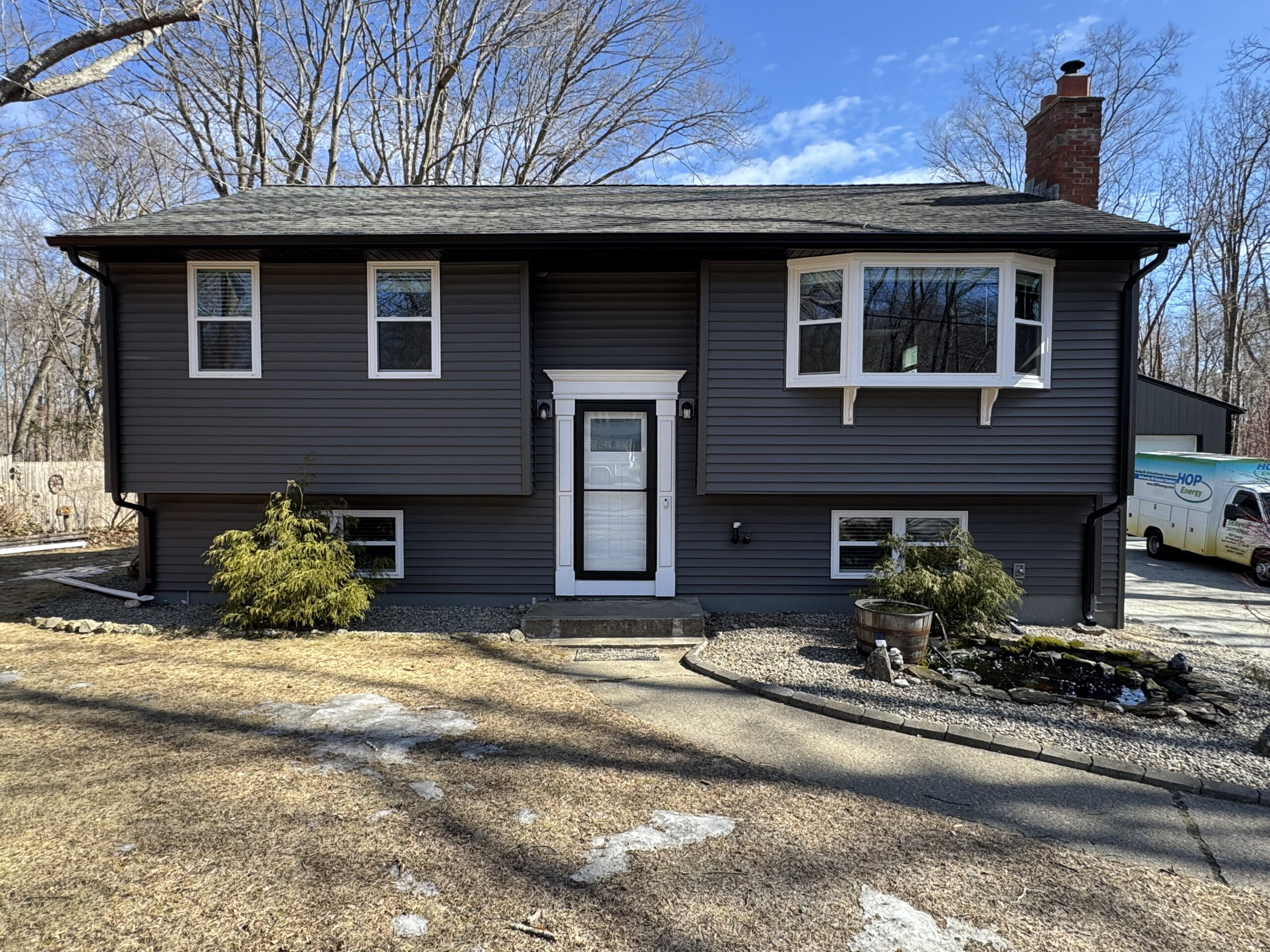 IMG_3798 Completed split-level home with new dark vinyl siding built by Lagace Construction
